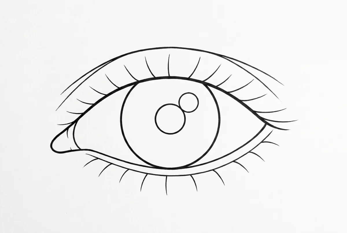 Un ojo construido con círculos y líneas de guía antes del detalle